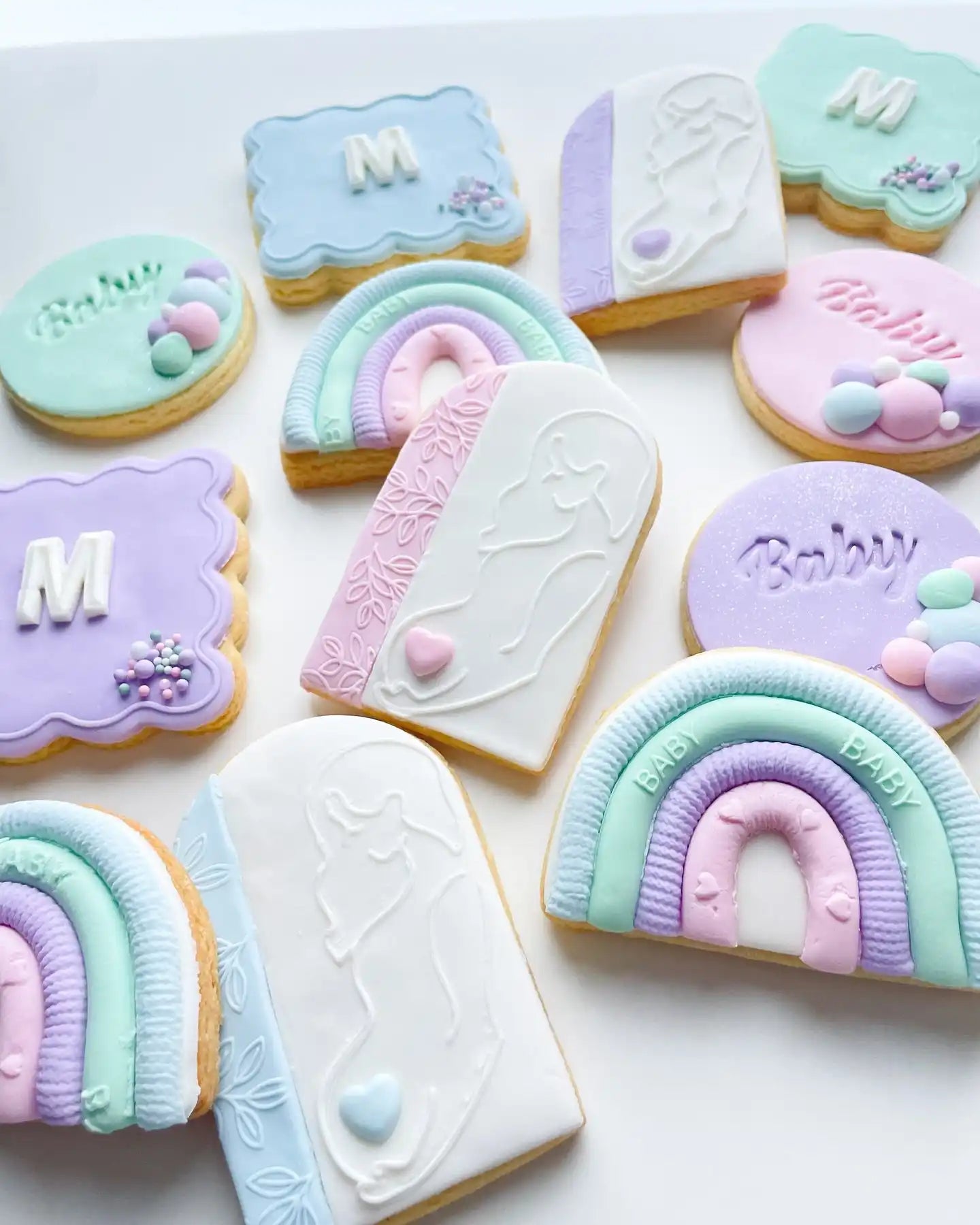 Pastel-colored baby shower cookies.